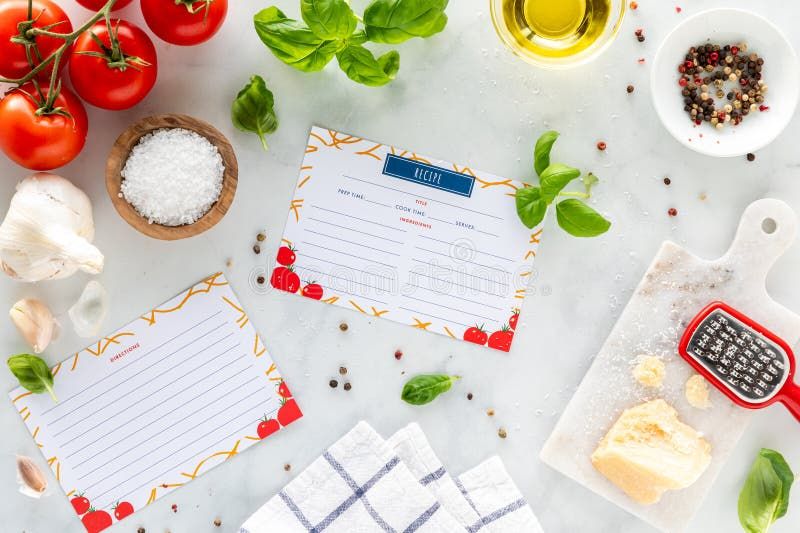 Friske råvarer som tomater og basilikum klar til en hurtig måltidskasse-opskrift.